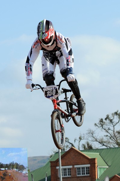Trent Woodcock (No 150) goes high over the supercross jumps during qualifying time trials in the elite junior men's competition at the UCI BMX World Championships in Pietermariztberg, South Africa.
